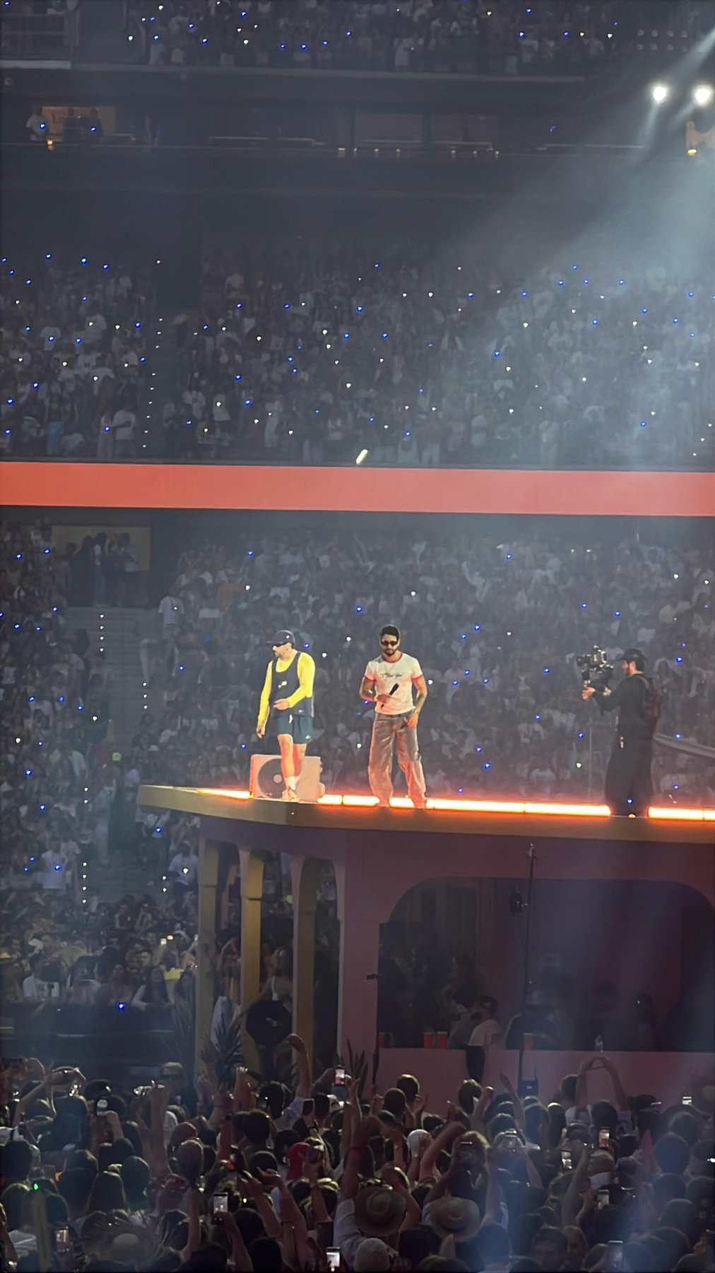 Bad Bunny performing with Mora at a concert in Madrid